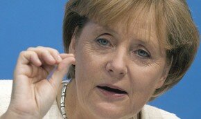 Меркель пригрозила России санкциями `третьего уровня` 