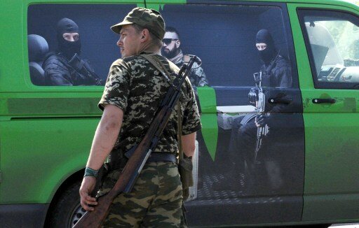 Грузовики с боевиками прорвались в Луганск из России | Фото: AFP