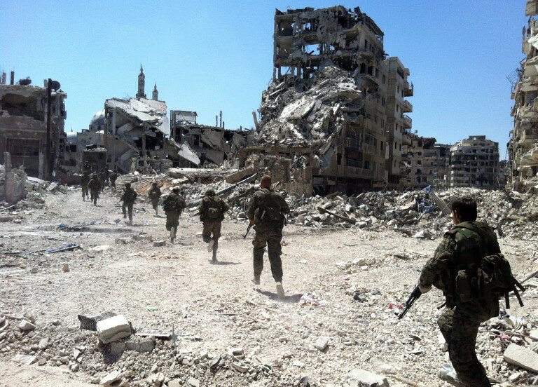 Сирийская армия отбила район повстанцев в Хомсе | Фото: AFP