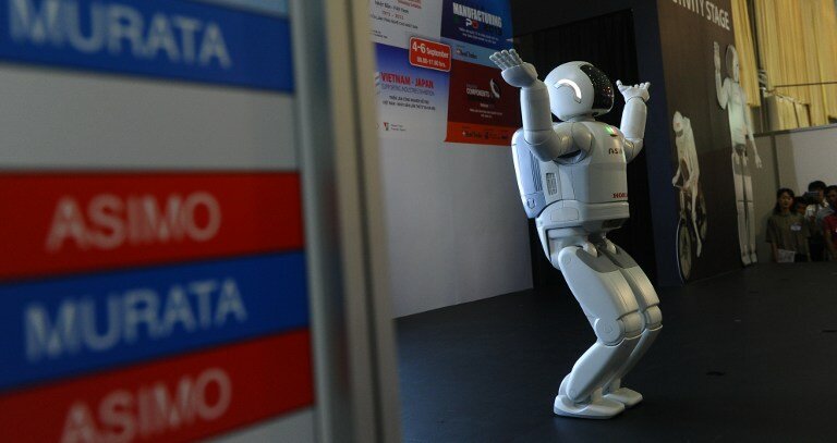 Японский робот Asimo открыл выставку | Фото: AFP